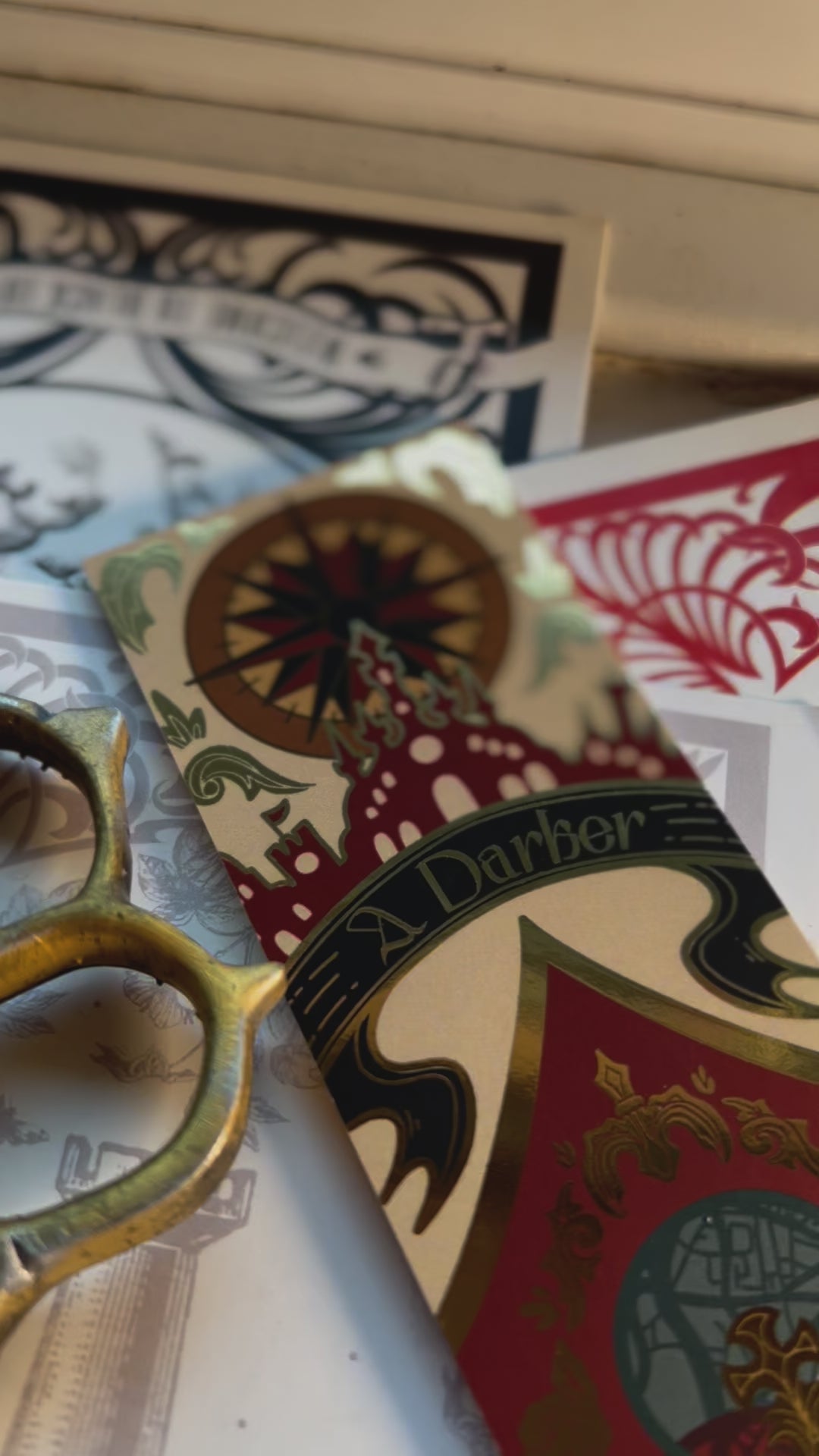 A video clip of about 10 seconds showcasing the close up detailing of A Darker Shade of Magic by V E Schwab inspired book spine bookmark.