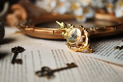 A close up image of No0neDesigns Bridgerton Bee Knocker pin with a focus on the silk bee printing detail in the centre. 