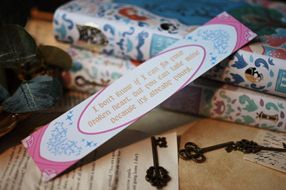 The Once Upon A Broken Heart inspired bookspine bookmark featuring the reverse side quote of: "I don't know if I can fix your broken heart but you can take mine because its already yours"