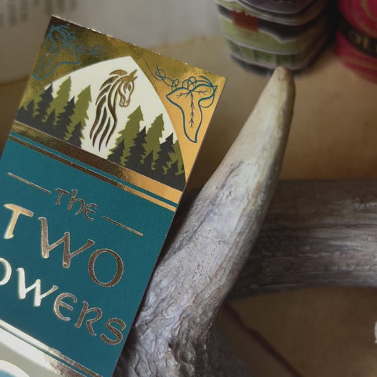 Close up video showcasing all the details of the No0neDesigns The Two Towers inspired book spine bookmark; showcasing the small illustrations and foil detailing.