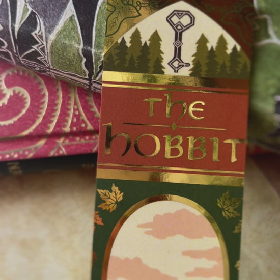 A close up video showcasing all the small foil details of the No One Designs foiled bookspine bookmark inspired by The Hobbit by J.R.R Tolkien