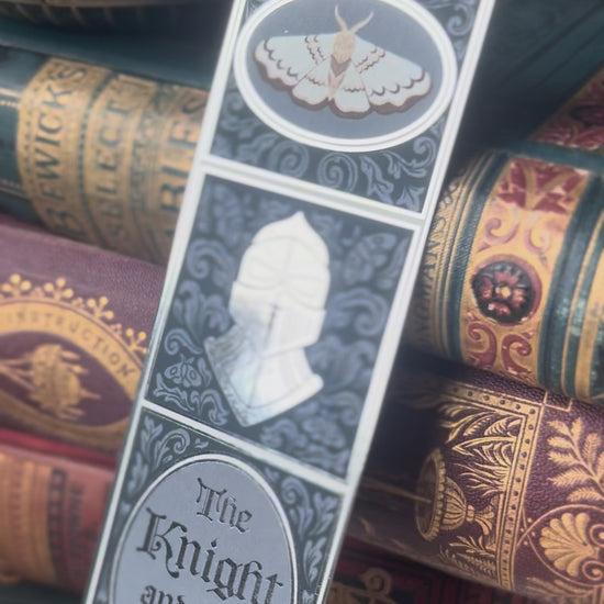 Video showcasing the details and silver foiling of The Knight and The Moth bookmark.